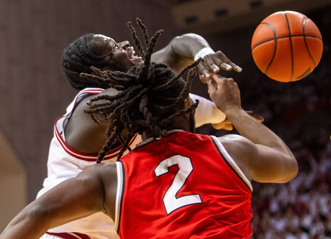 Indiana's Oumar Ballo (11) has the ball knocked away by Ohio State's Bruce Thornton (2) during the Indiana versus Ohio State men's basketball game at Simon Skjodt Assembly Hall on Saturday, March 8, 2025.