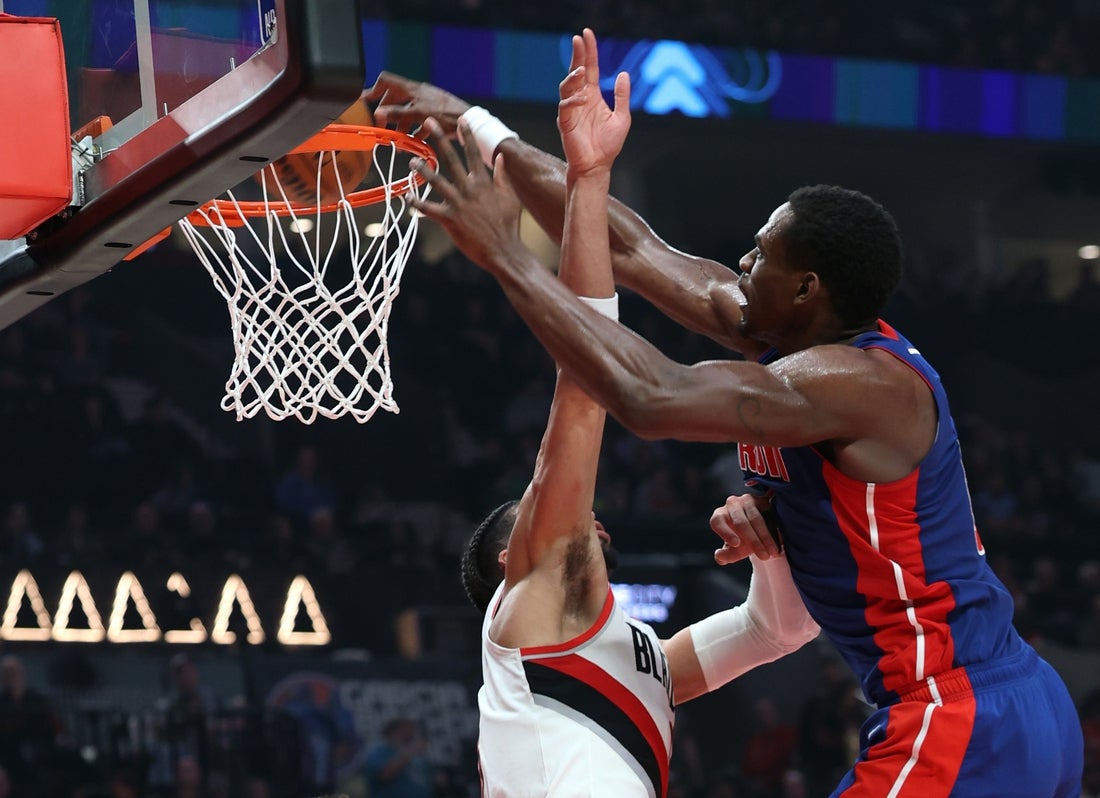 Mar 9, 2025; Portland, Oregon, USA; Detroit Pistons center Jalen Duren (0) dunks over Portland Trail Blazers forward Toumani Camara (33) in the second half at Moda Center. Mandatory Credit: Jaime Valdez-Imagn Images