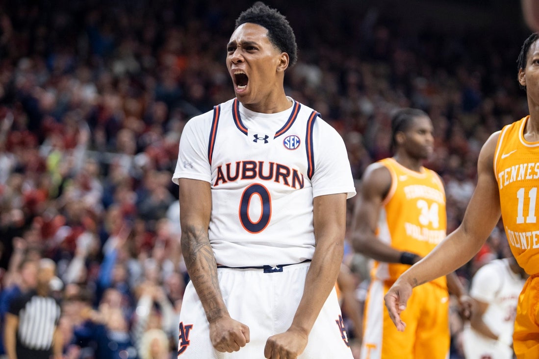 Auburn Tigers guard Tahaad Pettiford (0) celebrates his and-one basket as Auburn Tigers take on Tennessee Volunteers at Neville Arena in Auburn, Ala., on Saturday, Jan. 25, 2025. Auburn Tigers defeated Tennessee Volunteers 53-51.