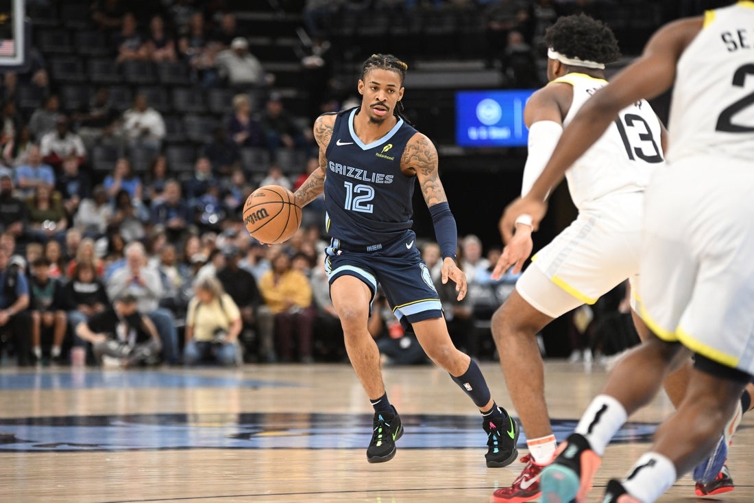 Mar 12, 2025; Memphis, Tennessee, USA; Memphis Grizzlies point guard Ja Morant (12) dribbles at the top of key during the Memphis Grizzlies vs. Utah Jazz game at FedExForum. Mandatory Credit: Matthew Smith-Imagn Images
