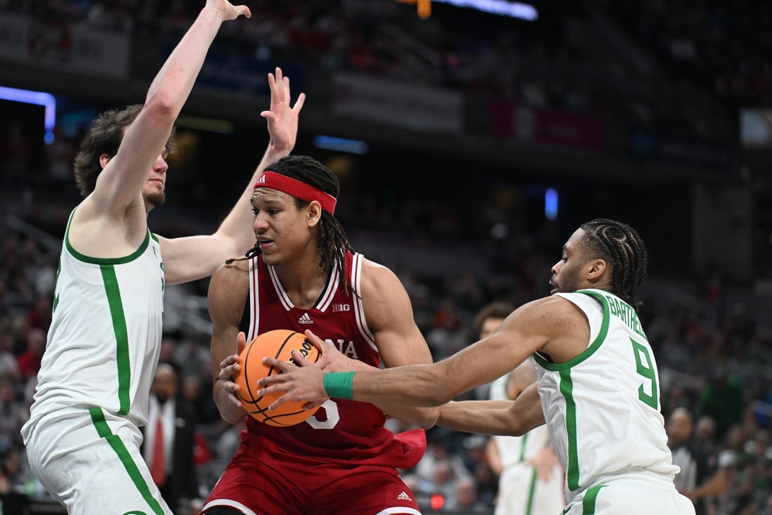 Mar 13, 2025; Indianapolis, IN, USA; Oregon Ducks guard Keeshawn Barthelemy (9) knocks the ball away from Indiana Hoosiers forward Malik Reneau (5) during the second half at Gainbridge Fieldhouse. Mandatory Credit: Robert Goddin-Imagn Images