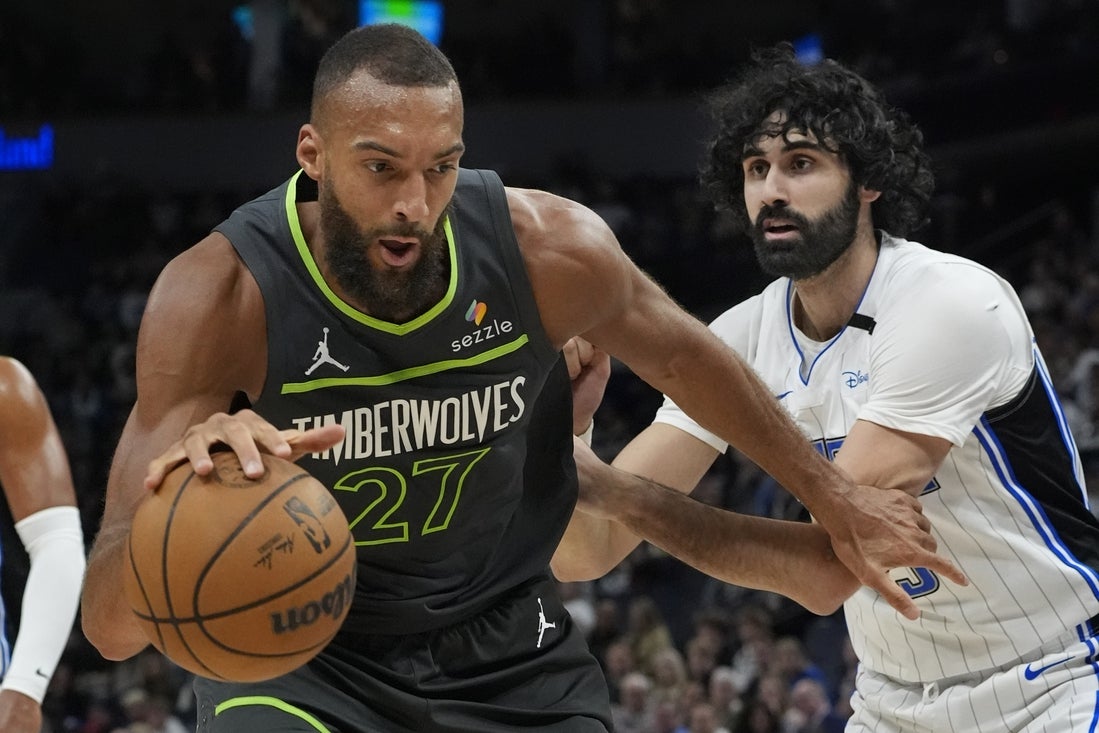 Mar 14, 2025; Minneapolis, Minnesota, USA; Minnesota Timberwolves center Rudy Gobert (27) works past Orlando Magic center Goga Bitadze (35) at Target Center. Mandatory Credit: Bruce Kluckhohn-Imagn Images