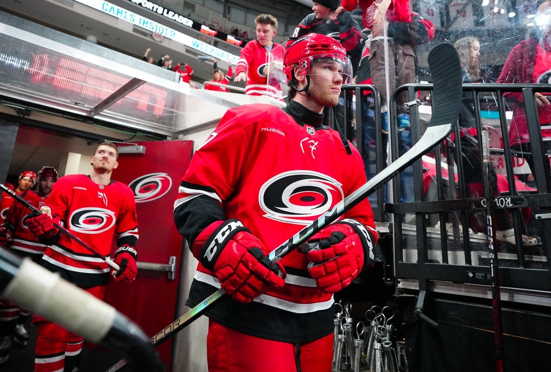 Mar 14, 2025; Raleigh, North Carolina, USA; Carolina Hurricanes center Mark Jankowski (77) comes out of the locker room for the warmups before the game against the Detroit Red Wings at Lenovo Center. Mandatory Credit: James Guillory-Imagn Images