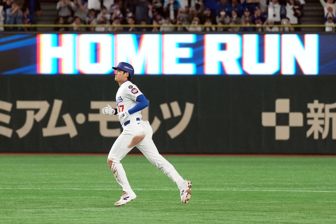 Mar 15, 2025; Bunkyo, Tokyo, Japan; Los Angeles Dodgers designated hitter Shohei Ohtani (17) rounds the bases after hitting a home run against the Yomiuri Giants during the third inning at Tokyo Dome. Mandatory Credit: Darren Yamashita-Imagn Images