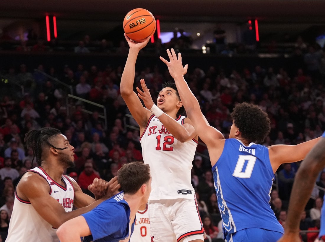 Mar 15, 2025; New York, NY, USA; St. John's Red Storm guard RJ Luis Jr. (12) shoots against the Creighton Bluejays in the first half at Madison Square Garden. Mandatory Credit: Robert Deutsch-Imagn Images