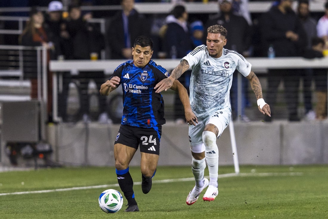 Mar 15, 2025; San Jose, California, USA; San Jose Earthquakes defender Nick Lima (24) and Colorado Rapids forward Rafael Navarro (9) battle for possession during the first half at PayPal Park. Mandatory Credit: John Hefti-Imagn Images