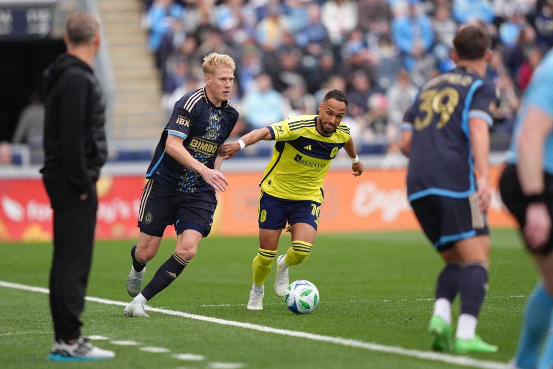 Mar 16, 2025; Chester, Pennsylvania, USA; Philadelphia Union defender Jakob Glesnes (5) controls the ball against Nashville SC midfielder Hany Mukhtar (10) in the first half at Subaru Park. Mandatory Credit: Kyle Ross-Imagn Images