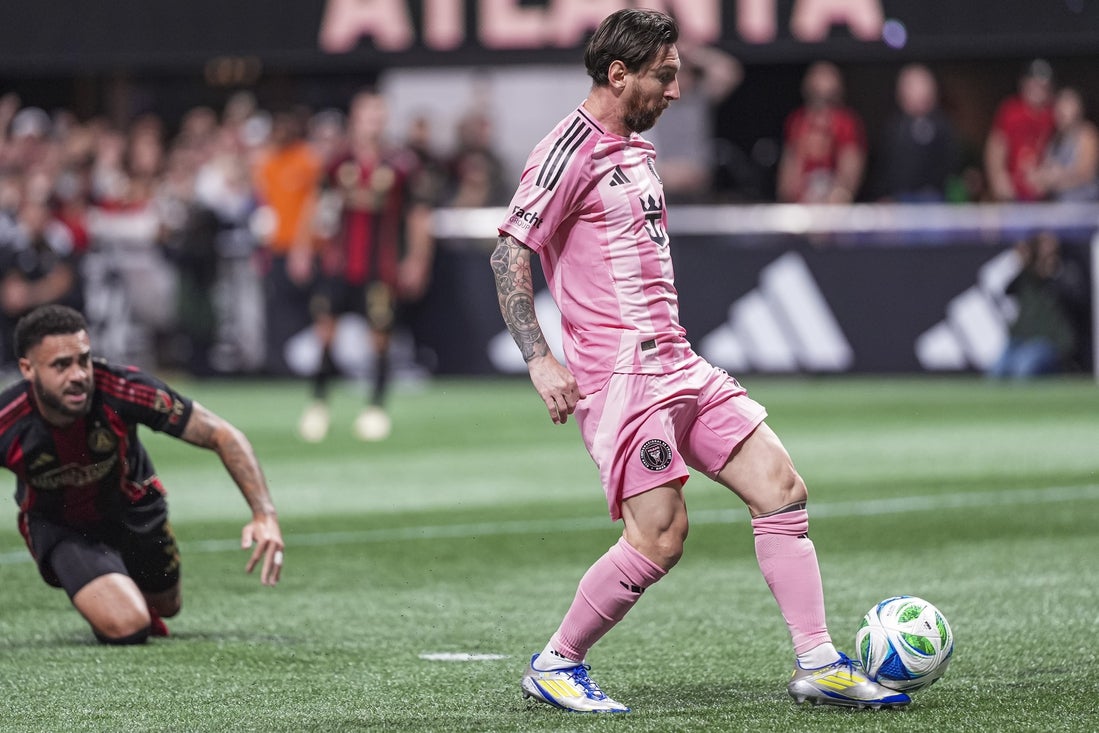 Mar 16, 2025; Atlanta, Georgia, USA; Inter Miami forward Lionel Messi (10) gets behind Atlanta United defender Derrick Williams (3) to score a goal during the first half at Mercedes-Benz Stadium. Mandatory Credit: Dale Zanine-Imagn Images