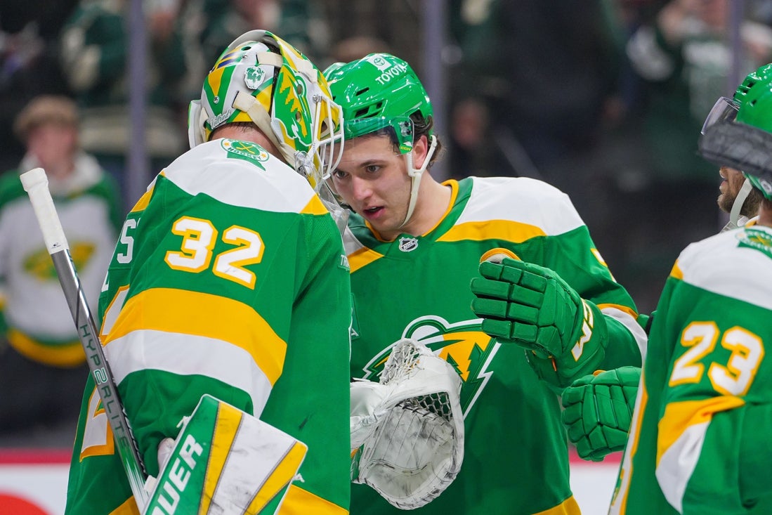 Mar 17, 2025; Saint Paul, Minnesota, USA; Minnesota Wild defenseman Brock Faber (7) celebrates with goaltender Filip Gustavsson (32) after the game against the Los Angeles Kings at Xcel Energy Center. Mandatory Credit: Brad Rempel-Imagn Images