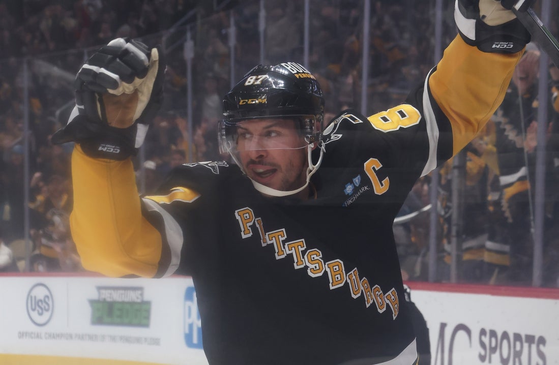 Mar 18, 2025; Pittsburgh, Pennsylvania, USA; Pittsburgh Penguins center Sidney Crosby (87) reacts after scoring a goal against the New York Islanders during the first period at PPG Paints Arena. Mandatory Credit: Charles LeClaire-Imagn Images