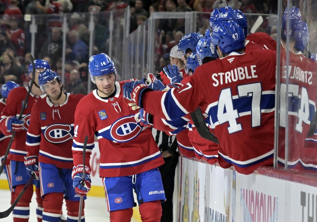Mar 18, 2025; Montreal, Quebec, CAN; Montreal Canadiens forward Nick Suzuki (14) celebrates with teammates after scoring a goal against the Ottawa Senators during the third period at the Bell Centre. Mandatory Credit: Eric Bolte-Imagn Images