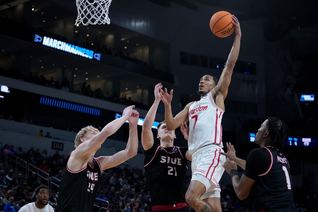 Mar 20, 2025; Wichita, KS, USA; Houston Cougars guard Milos Uzan (7) shoots against SIU Edwardsville Cougars center Arnas Sakenis (34), forward Myles Thompson (21) and guard Jordan Pickett (1) in the first half of a first round men’s NCAA Tournament game at Intrust Bank Arena. Mandatory Credit: Kirby Lee-Imagn Images