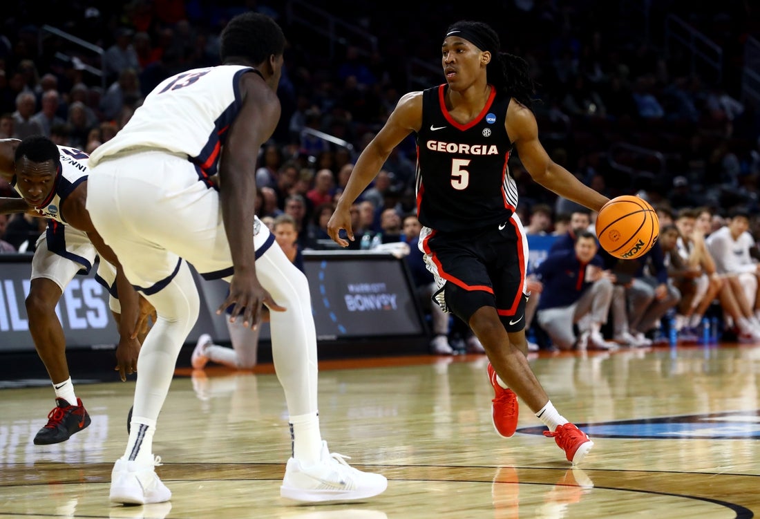 Mar 20, 2025; Wichita, KS, USA; Georgia Bulldogs guard Silas Demary Jr. (5) dribbles against Gonzaga Bulldogs forward Graham Ike (13) in the second half of a first round men’s NCAA Tournament game at Intrust Bank Arena. Mandatory Credit: Nick Tre. Smith-Imagn Images