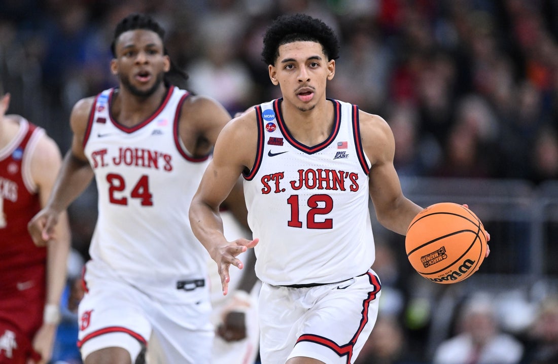 Mar 22, 2025; Providence, RI, USA; St. John's Red Storm guard RJ Luis Jr. (12) dribbles during the second half of a second round men’s NCAA Tournament game against the Arkansas Razorbacks at Amica Mutual Pavilion. Mandatory Credit: Brian Fluharty-Imagn Images
