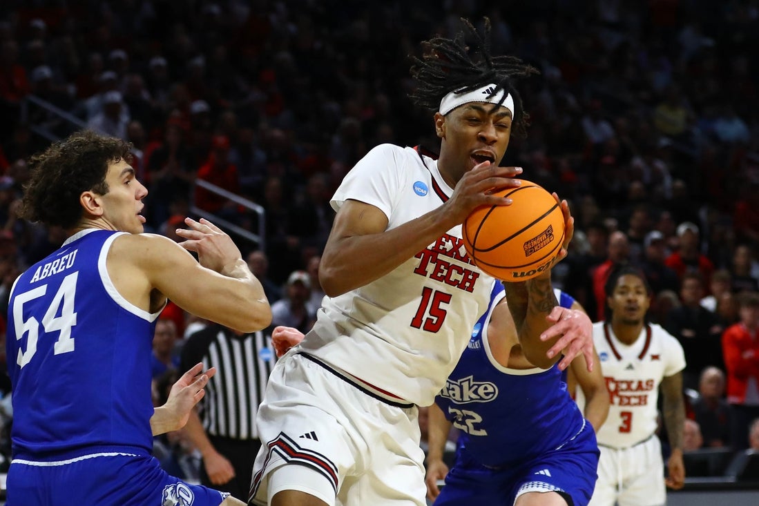 Mar 22, 2025; Wichita, KS, USA; Texas Tech Red Raiders forward JT Toppin (15) controls the ball against Drake Bulldogs forward Daniel Abreu (54) during the first half at Intrust Bank Arena. Mandatory Credit: Nick Tre. Smith-Imagn Images