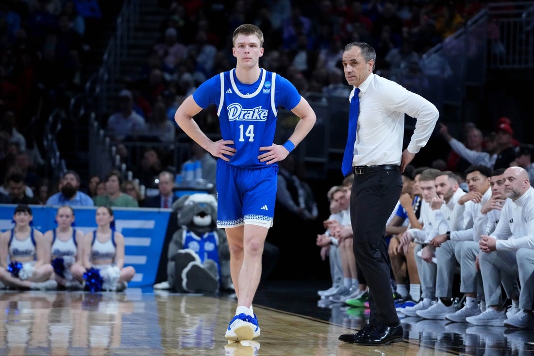 Mar 22, 2025; Wichita, KS, USA; Drake Bulldogs guard Bennett Stirtz (14) talks with head coach Ben McCollum during the second half at Intrust Bank Arena. Mandatory Credit: Kirby Lee-Imagn Images