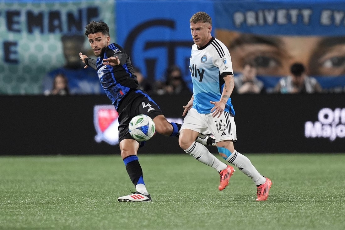Mar 22, 2025; Charlotte, North Carolina, USA; San Jose Earthquakes defender Bruno Wilson (4) catches the ball against Charlotte FC midfielder Pep Biel (16) during the first half at Bank of America Stadium. Mandatory Credit: Jim Dedmon-Imagn Images