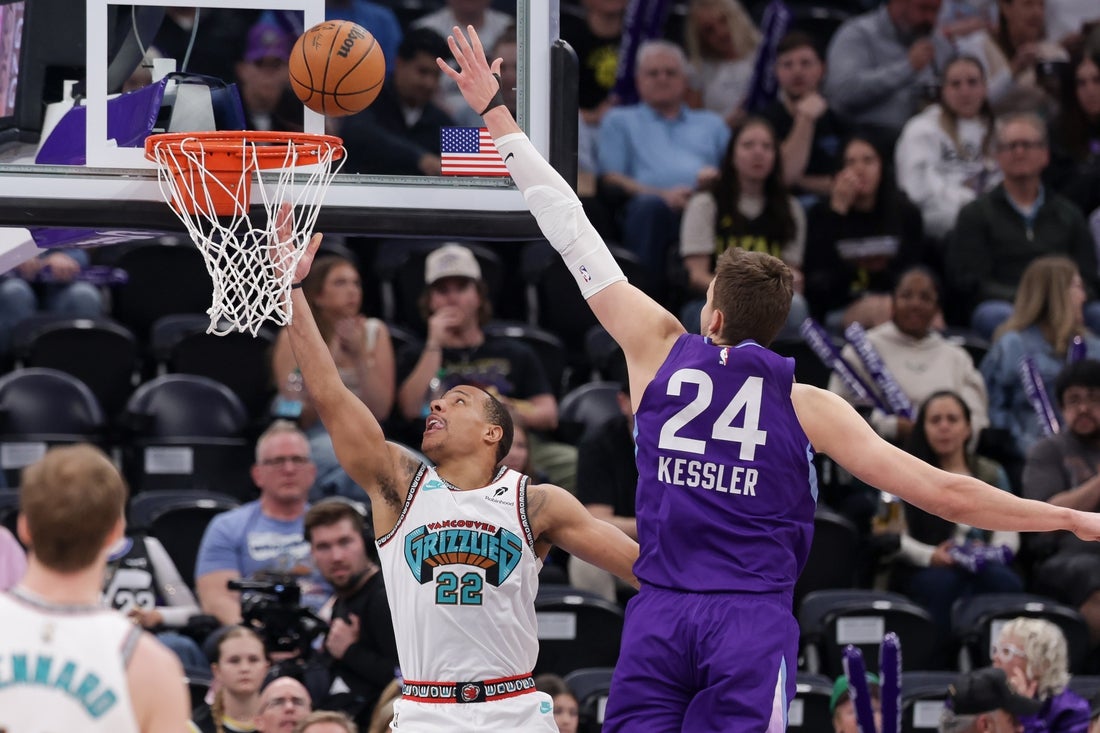 Mar 25, 2025; Salt Lake City, Utah, USA; Memphis Grizzlies guard Desmond Bane (22) gets past Utah Jazz center Walker Kessler (24) and to the basket during the first quarter at Delta Center. Mandatory Credit: Chris Nicoll-Imagn Images
