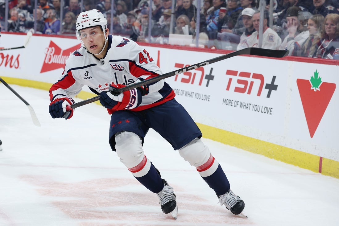 Mar 25, 2025; Winnipeg, Manitoba, CAN; Washington Capitals defenseman Martin Fehervary (42) skates up the ice against the Winnipeg Jets in the second period at Canada Life Centre. Mandatory Credit: James Carey Lauder-Imagn Images