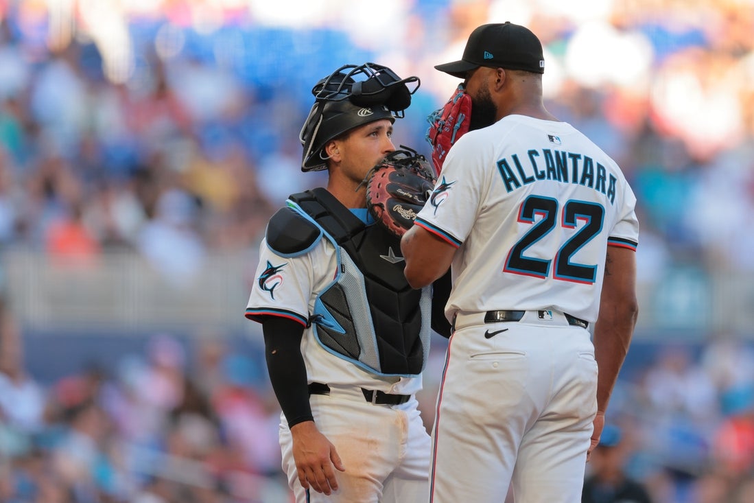 Mar 27, 2025; Miami, Florida, USA; Miami Marlins catcher Nick Fortes (4) talks to starting pitcher Sandy Alcantara (22) during the fifth inning at loanDepot Park. Mandatory Credit: Sam Navarro-Imagn Images