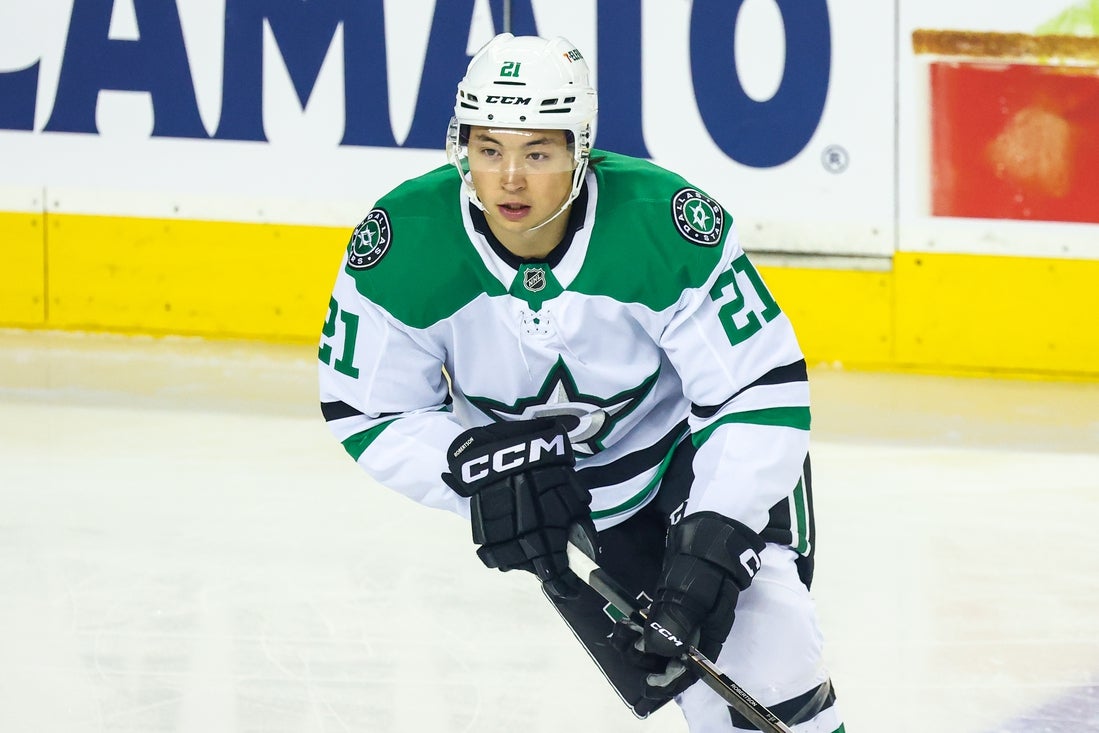 Mar 27, 2025; Calgary, Alberta, CAN; Dallas Stars left wing Jason Robertson (21) skates during the warmup period against the Calgary Flames at Scotiabank Saddledome. Mandatory Credit: Sergei Belski-Imagn Images