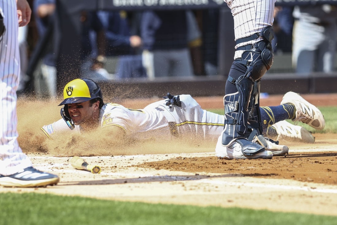 Mar 29, 2025; Bronx, New York, USA; Milwaukee Brewers right fielder Sal Frelick (10) slides into home plate in the second inning against the New York Yankees at Yankee Stadium. Mandatory Credit: Wendell Cruz-Imagn Images