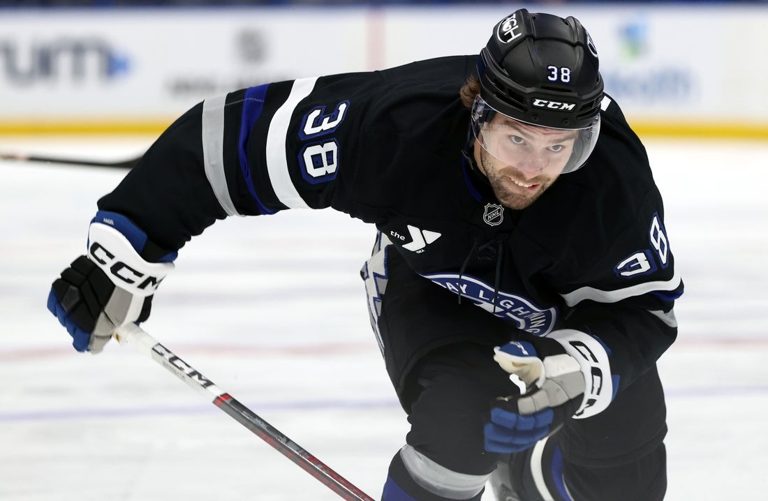 Mar 29, 2025; Tampa, Florida, USA; Tampa Bay Lightning left wing Brandon Hagel (38) skates against the New York Islanders during the second period at Amalie Arena. Mandatory Credit: Kim Klement Neitzel-Imagn Images