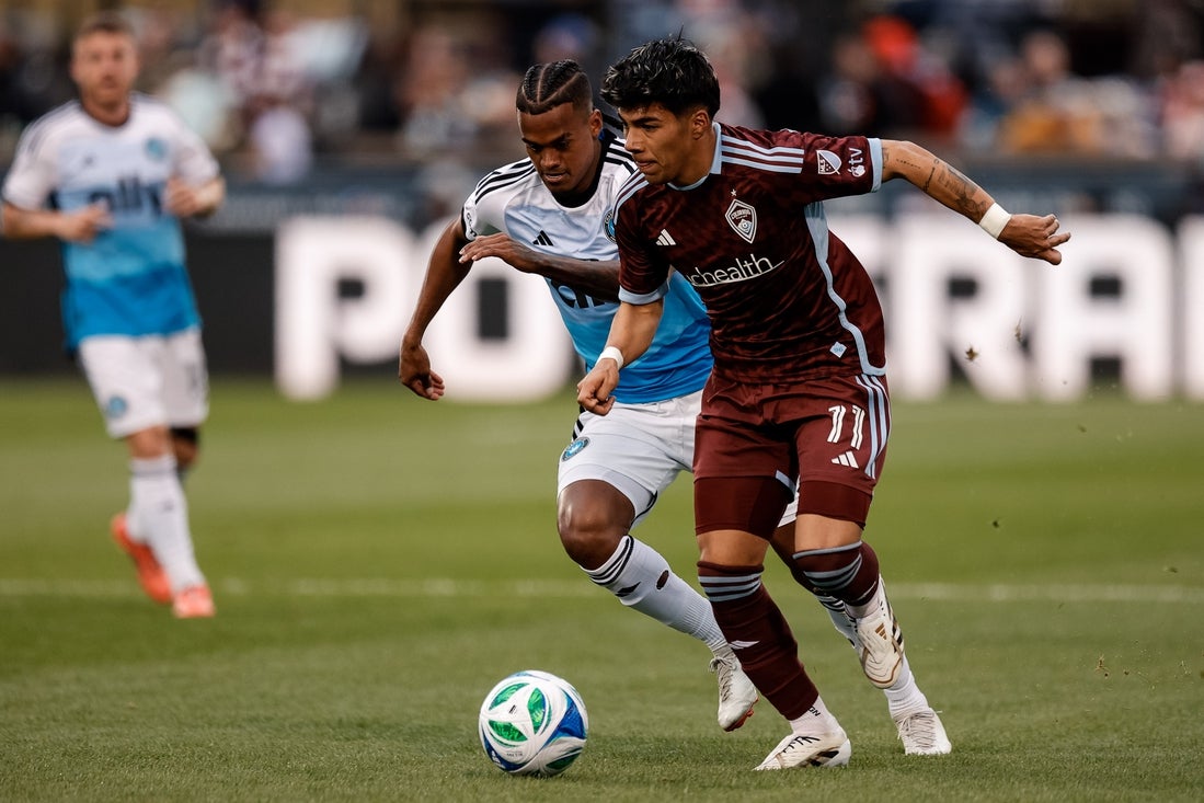 Mar 29, 2025; Commerce City, Colorado, USA; Colorado Rapids midfielder Omir Fernandez (11) controls the ball ahead of Charlotte FC forward Kerwin Vargas (18) in the second half at Dick's Sporting Goods Park. Mandatory Credit: Isaiah J. Downing-Imagn Images