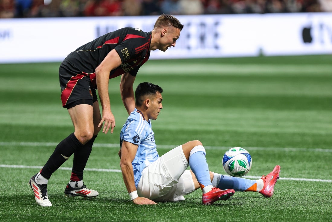Mar 29, 2025; Atlanta, Georgia, USA; Atlanta United defender Stian Gregersen (5) competes against New York City forward Alonso Martínez (16) for possession of the ball during the first half at Mercedes-Benz Stadium. Mandatory Credit: Jordan Godfree-Imagn Images