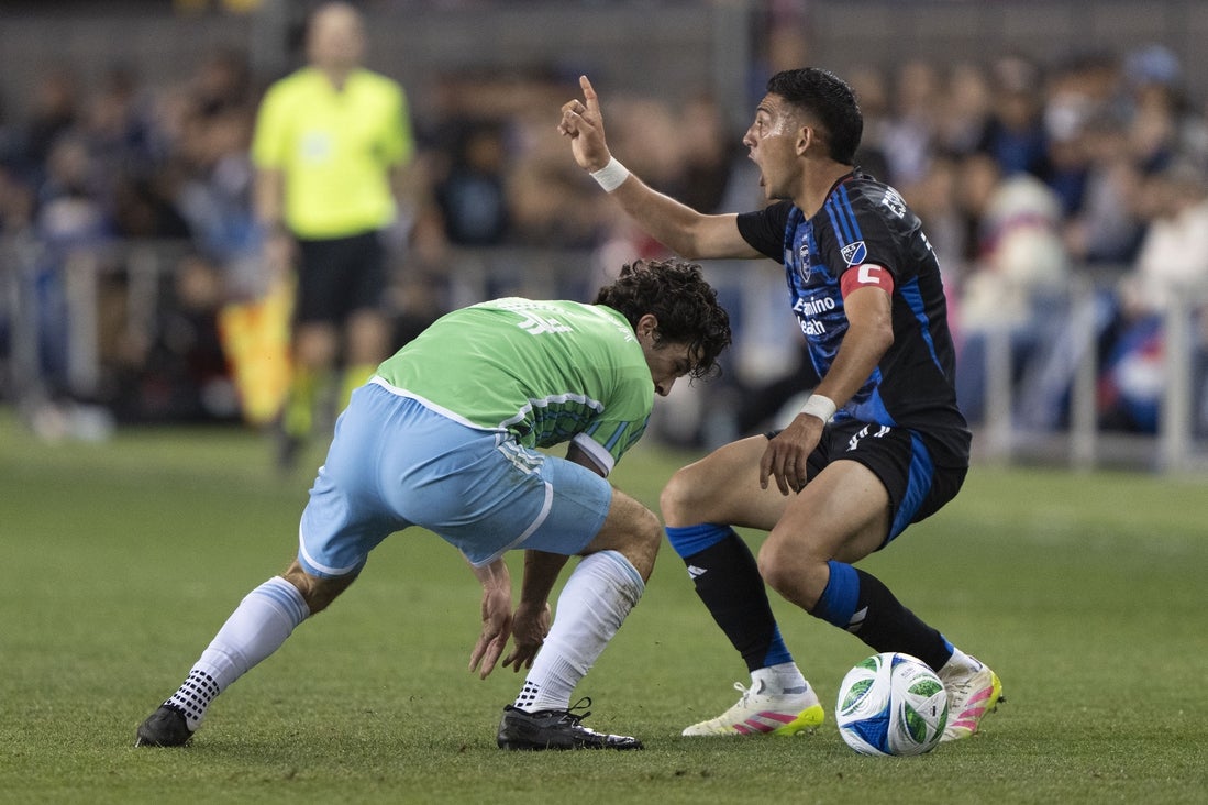 Mar 29, 2025; San Jose, California, USA; San Jose Earthquakes forward Cristian Espinoza (10) reacts to the referee’s whistle during the first half against Seattle Sounders midfielder Paul Rothrock (14) at PayPal Park. Mandatory Credit: Stan Szeto-Imagn Images