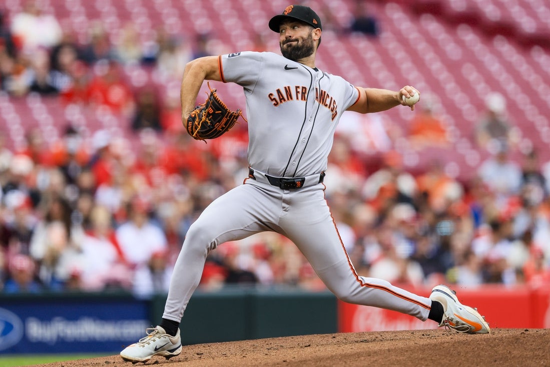 Mar 30, 2025; Cincinnati, Ohio, USA; San Francisco Giants starting pitcher Robbie Ray (38) pitches against the Cincinnati Reds in the first inning at Great American Ball Park. Mandatory Credit: Katie Stratman-Imagn Images