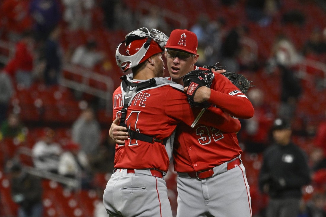 Mar 31, 2025; St. Louis, Missouri, USA; Los Angeles Angels catcher Logan O'Hoppe (14) and relief pitcher Ryan Johnson (32) celebrate their victory over the St. Louis Cardinals at Busch Stadium. Mandatory Credit: Joe Puetz-Imagn Images