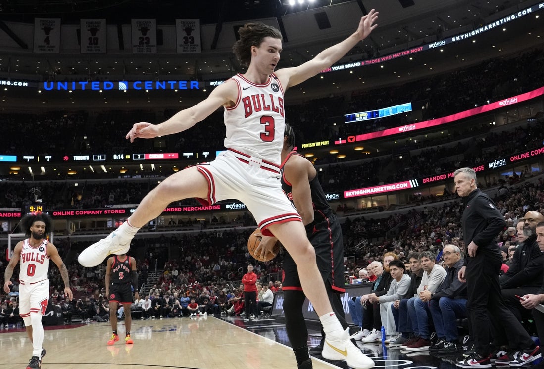 Apr 1, 2025; Chicago, Illinois, USA; Chicago Bulls guard Josh Giddey (3) defends Toronto Raptors forward Scottie Barnes (4) during the first quarter at United Center. Mandatory Credit: David Banks-Imagn Images