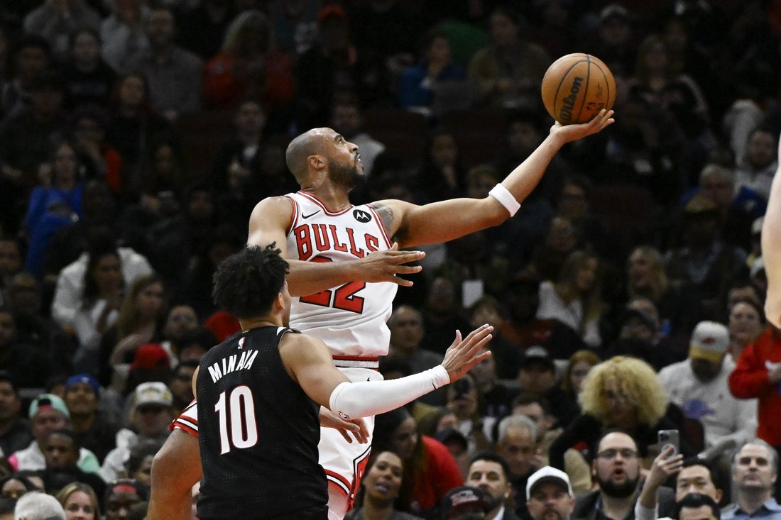 Apr 4, 2025; Chicago, Illinois, USA; Chicago Bulls forward Talen Horton-Tucker (22) shoots past Portland Trail Blazers forward Justin Minaya (10) during the first half at United Center. Mandatory Credit: Matt Marton-Imagn Images