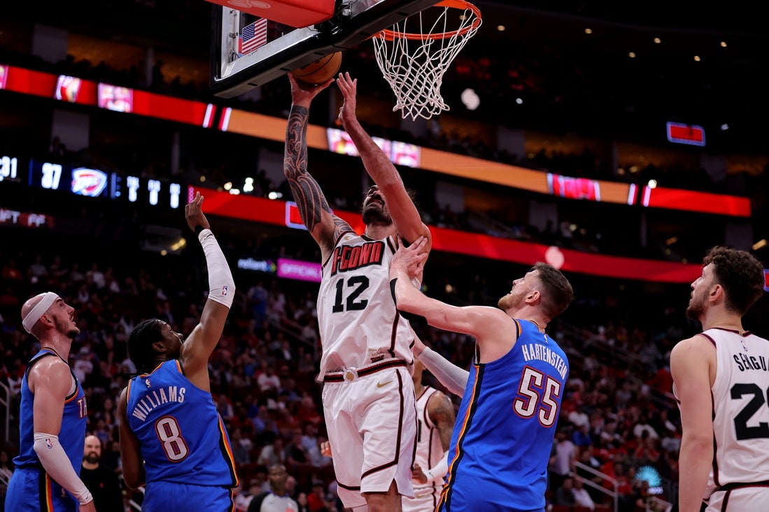 Apr 4, 2025; Houston, Texas, USA; Houston Rockets center Steven Adams (12) shoots inside against Oklahoma City Thunder center Isaiah Hartenstein (55) during the second quarter at Toyota Center. Mandatory Credit: Erik Williams-Imagn Images