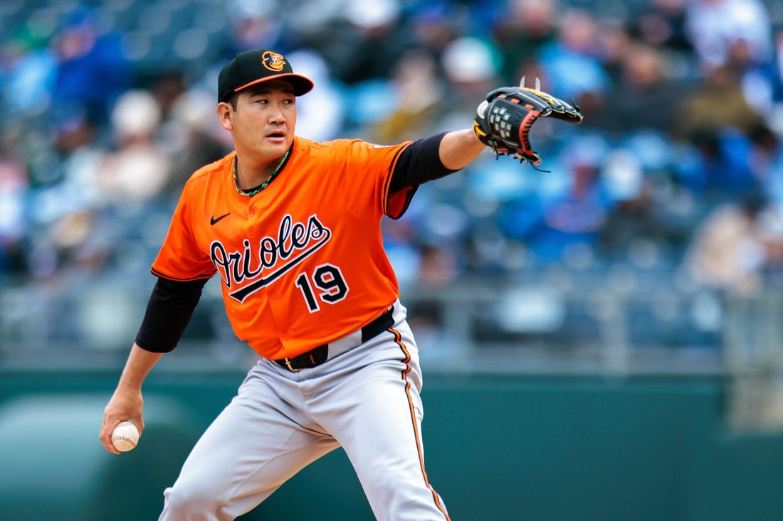 Apr 5, 2025; Kansas City, Missouri, USA; Baltimore Orioles pitcher Tomoyuki Sugano (19) pitches during the first inning against the Kansas City Royals at Kauffman Stadium. Mandatory Credit: William Purnell-Imagn Images