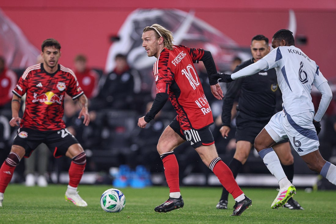 Apr 5, 2025; Harrison, New Jersey, USA; New York Red Bulls midfielder Emil Forsberg (10) controls the ball against Chicago Fire FC midfielder Rominigue Kouame (6) during the first half at Sports Illustrated Stadium. Mandatory Credit: Vincent Carchietta-Imagn Images