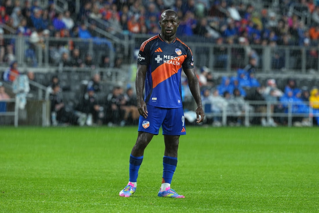 Apr 5, 2025; Cincinnati, Ohio, USA; FC Cincinnati forward Kevin Denkey (9) waits for play to resume during the first half against the New England Revolution at TQL Stadium. Mandatory Credit: Kareem Elgazzar-Imagn Images