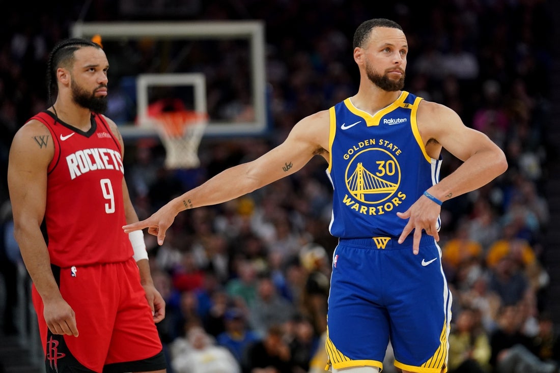 Apr 6, 2025; San Francisco, California, USA; Golden State Warriors guard Stephen Curry (30) reacts in front of Houston Rockets guard Dillon Brooks (9) after the Rockets attempted a free throw in the third quarter at the Chase Center. Mandatory Credit: Cary Edmondson-Imagn Images