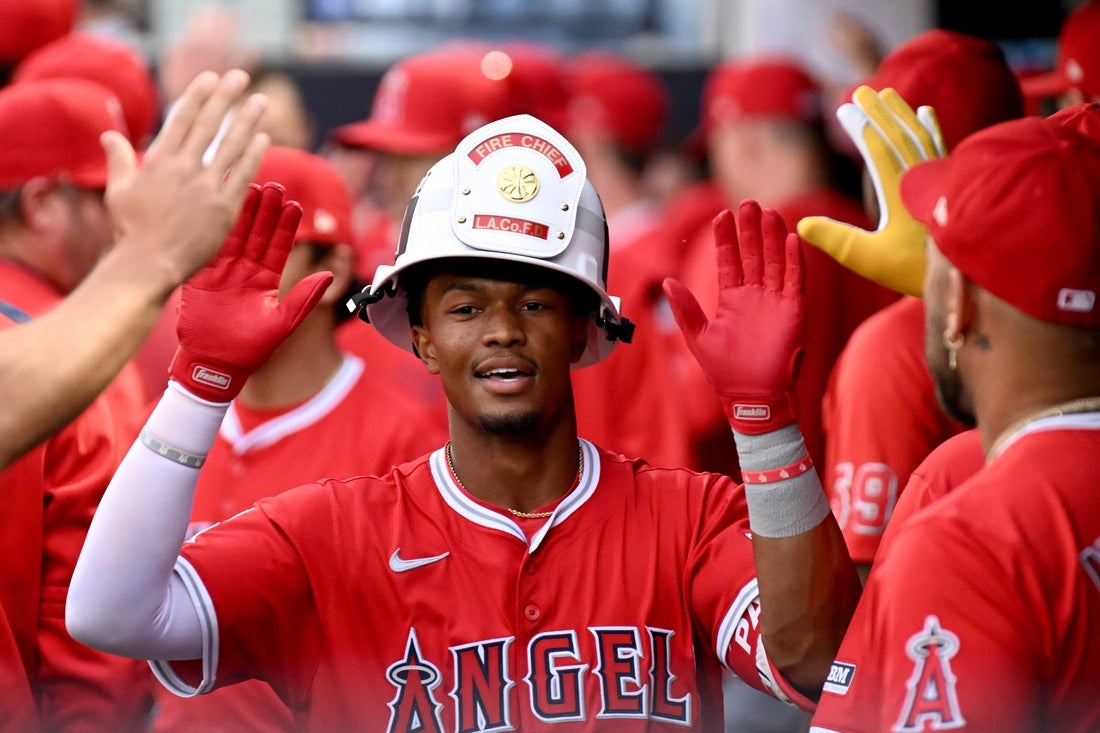 Apr 8, 2025; Tampa, Fla., USA; Los Angeles Angels second baseman Kyren Paris (19) celebrates with his teammates after hitting a two run home run in the second inning against the Tampa Bay Rays at George M. Steinbrenner Field. Mandatory Credit: Jonathan Dyer-Imagn Images
