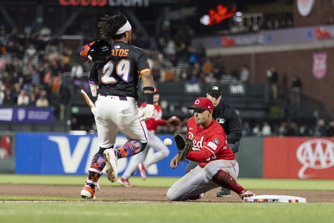 Apr 8, 2025; San Francisco, California, USA; Cincinnati Reds first baseman Christian Encarnacion-Strand (33) tags San Francisco Giants right fielder Luis Matos (29) during the seventh inning at Oracle Park. Mandatory Credit: John Hefti-Imagn Images