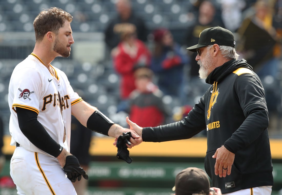 Apr 9, 2025; Pittsburgh, Pennsylvania, USA; Pittsburgh Pirates catcher Joey Bart (14) and manager Derek Shelton (17) celebrate after Bart hit a game winning walk off single to defeat the St. Louis Cardinals in the thirteenth inning at PNC Park. Mandatory Credit: Charles LeClaire-Imagn Images