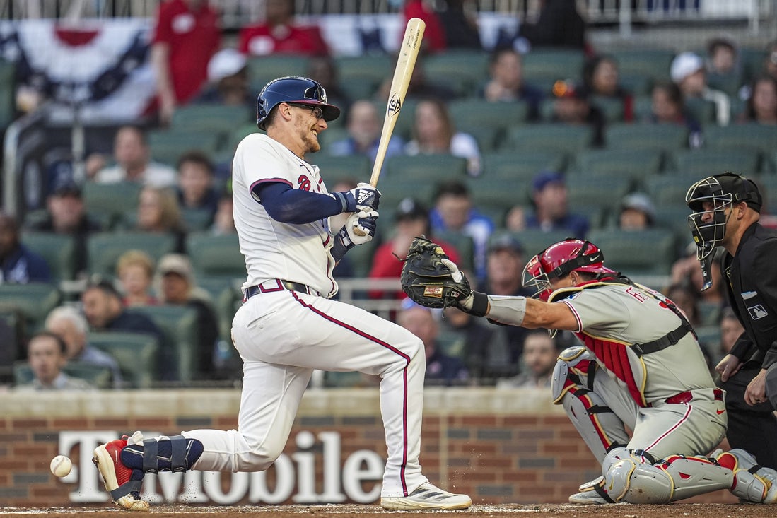 Apr 9, 2025; Cumberland, Georgia, USA; Atlanta Braves catcher Sean Murphy (12) reacts after being hit by a pitch against the Philadelphia Phillies during the second inning at Truist Park. Mandatory Credit: Dale Zanine-Imagn Images