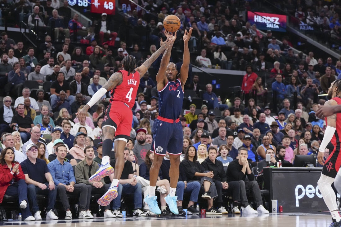 Apr 9, 2025; Inglewood, California, USA; Los Angeles Clippers guard Kawhi Leonard (2) shoots against Houston Rockets guard Jalen Green (4) in the first half at Intuit Dome. Mandatory Credit: Kirby Lee-Imagn Images
