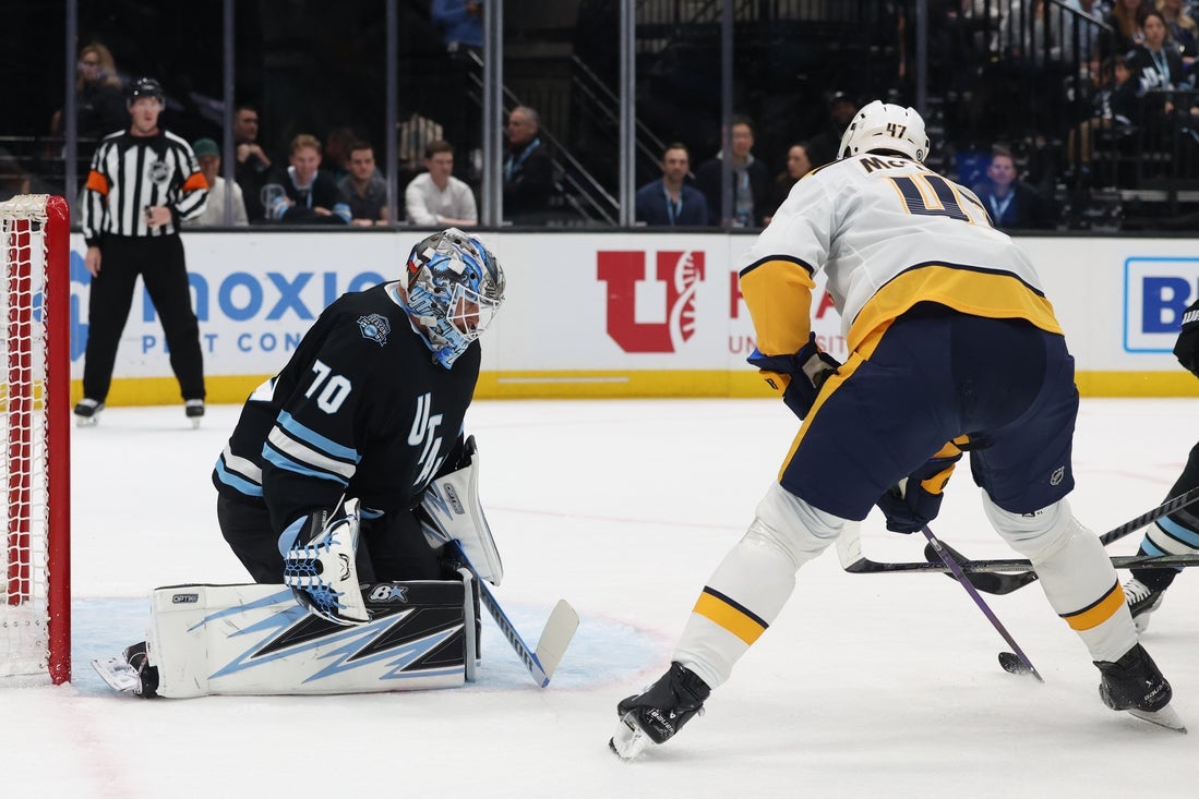 Apr 10, 2025; Salt Lake City, Utah, USA; Nashville Predators right wing Michael McCarron (47) looks to shoot on Utah Hockey Club goaltender Karel Vejmelka (70) during the first period at Delta Center. Mandatory Credit: Rob Gray-Imagn Images