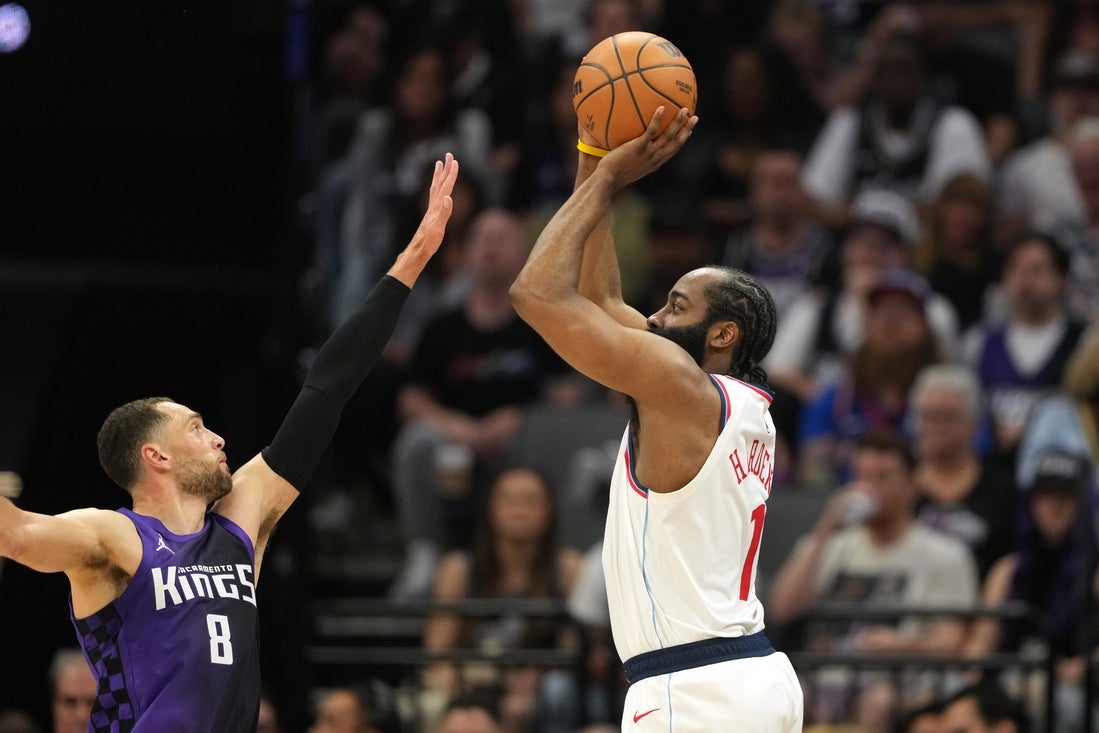 Apr 11, 2025; Sacramento, California, USA; Los Angeles Clippers guard James Harden (1) shoots against Sacramento Kings guard Zach LaVine (8) during the second quarter at Golden 1 Center. Mandatory Credit: Darren Yamashita-Imagn Images