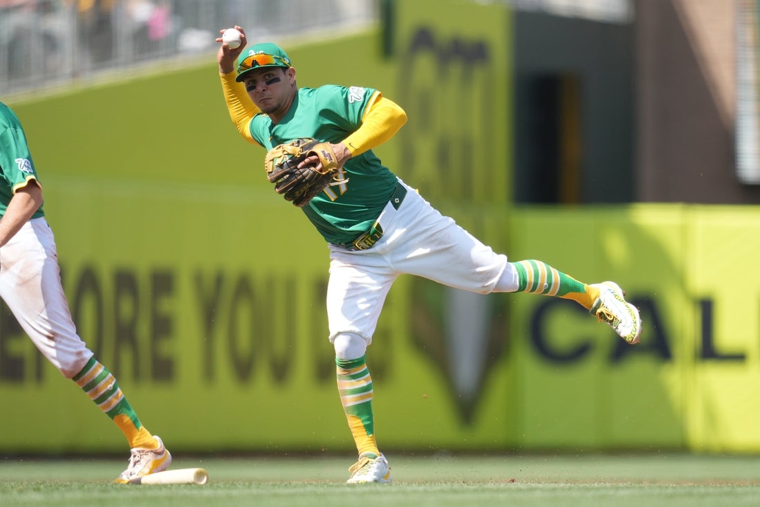 Apr 12, 2025; West Sacramento, California, USA; Athletics third baseman Luis Urias (17) throws the ball to first to record an out against the New York Mets in the fifth inning at Sutter Health Park. Mandatory Credit: Cary Edmondson-Imagn Images