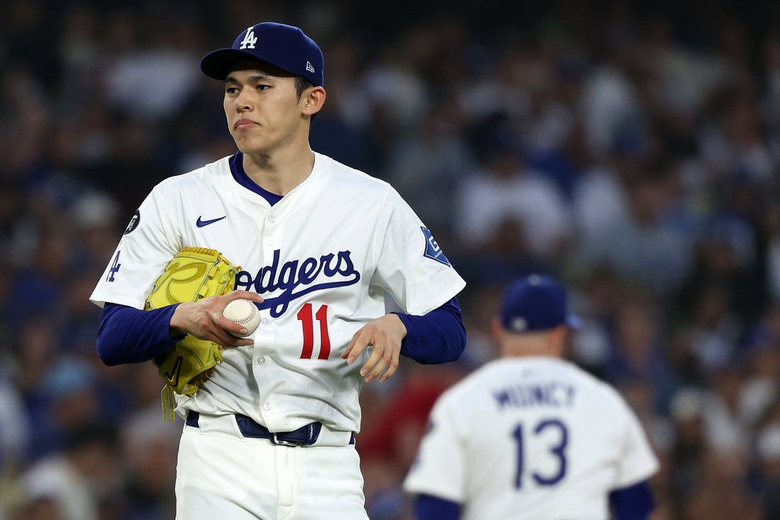 Apr 12, 2025; Los Angeles, California, USA; Los Angeles Dodgers pitcher Roki Sasaki (11) prepares to throw a pitch against the Chicago Cubs during the fifth inning at Dodger Stadium. Mandatory Credit: Kiyoshi Mio-Imagn Images