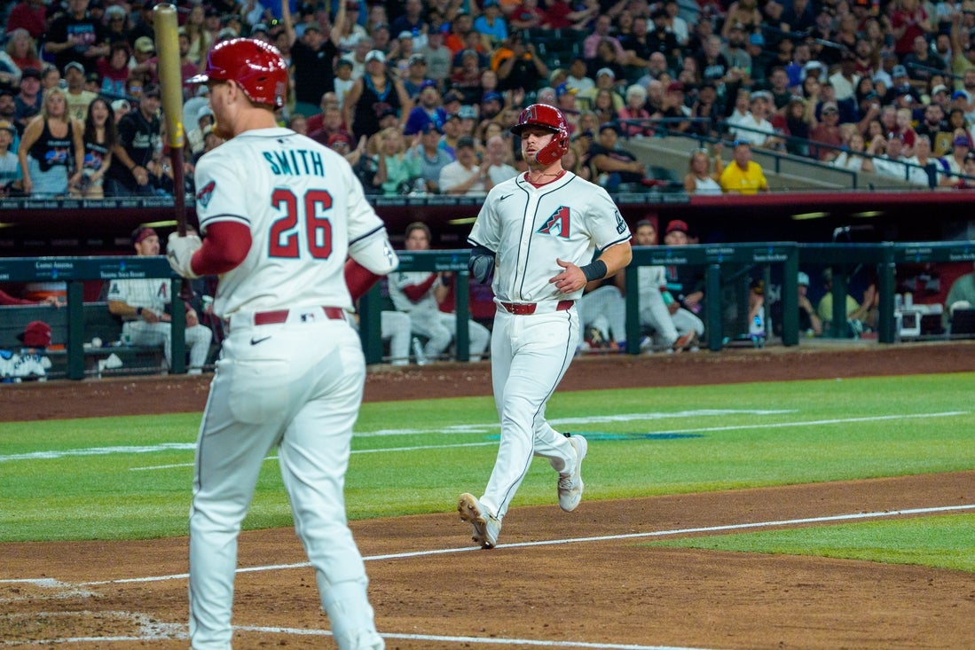 Apr 13, 2025; Phoenix, Arizona, USA; Arizona Diamondbacks infielder Tim Tawa (13) scores after a wild pitch during the fifth inning against the Milwaukee Brewers at Chase Field. Mandatory Credit: Allan Henry-Imagn Images