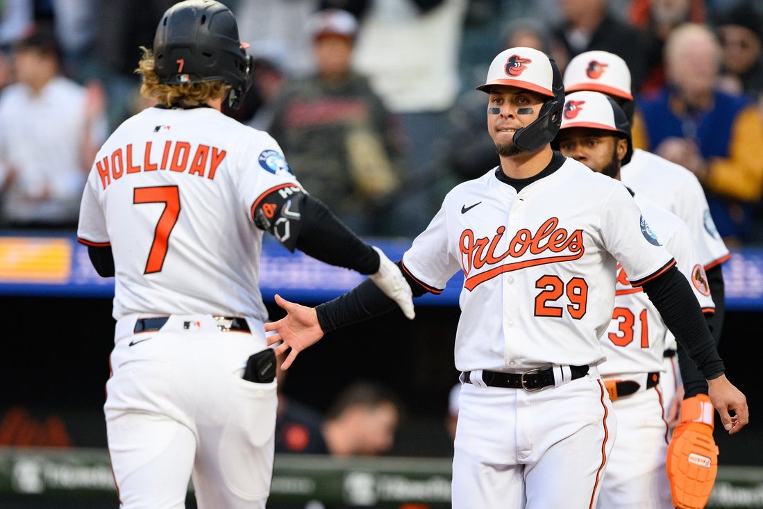 Apr 16, 2025; Baltimore, Maryland, USA; Baltimore Orioles third baseman Ramon Urias (29) celebrates with second baseman Jackson Holliday (7) after Holliday's grand slam in the second inning against the Cleveland Guardians at Oriole Park at Camden Yards. Mandatory Credit: Reggie Hildred-Imagn Images